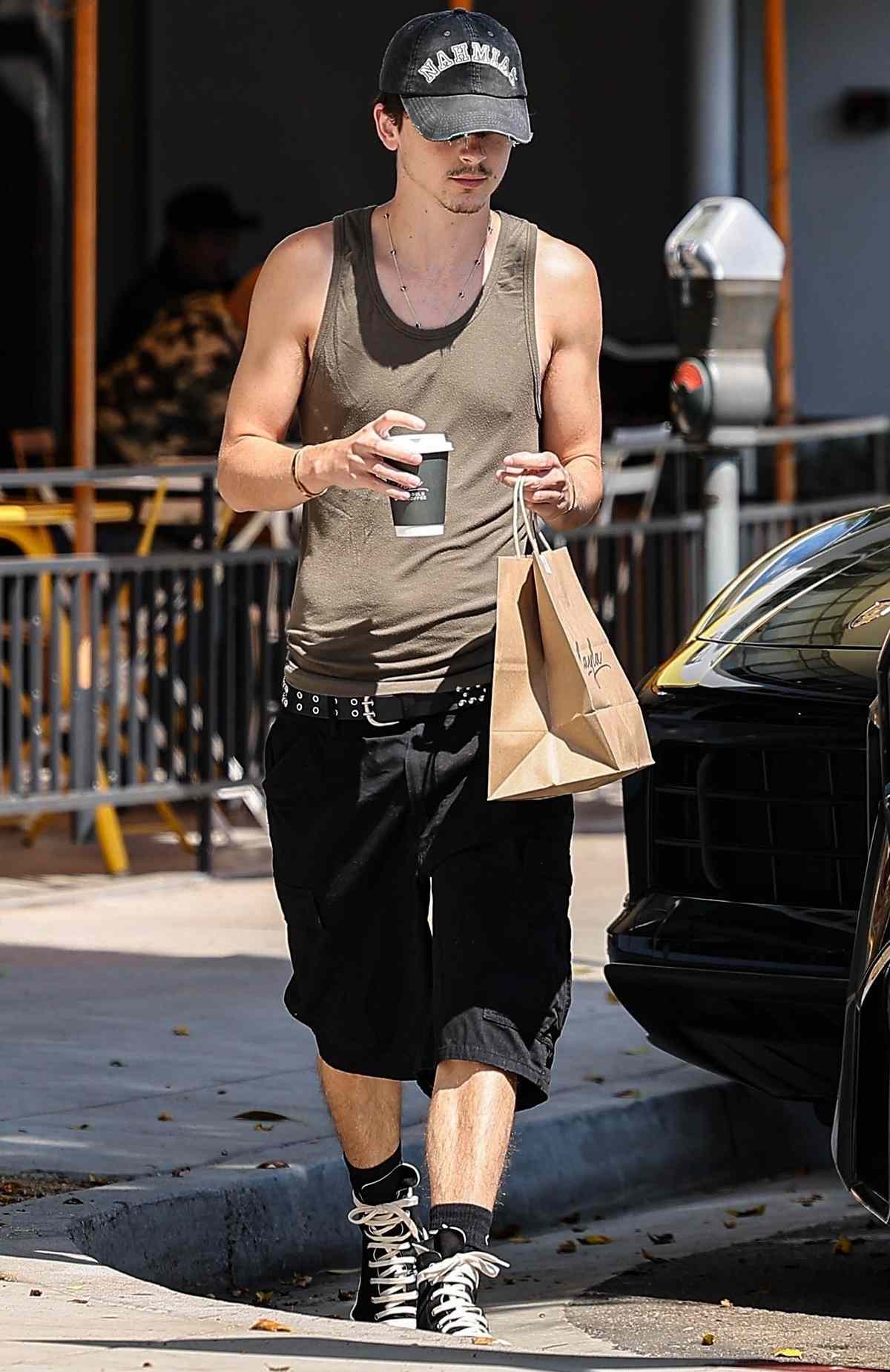 Timothee Chalamet shows off his skinny frame as he stops for coffee and a bagel in sunny Beverly Hills